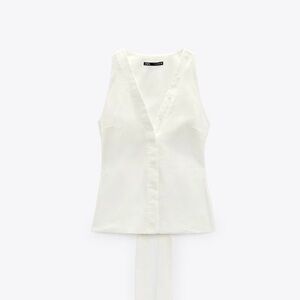 White blouse with open back